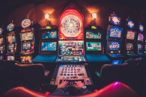 A close-up shot of golden coins falling around a spinning roulette wheel, representing immersive casino action at MINIMEO.