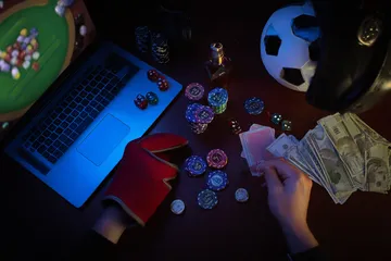 A glowing roulette wheel with cascading chips, symbolizing the engaging live and instant-win games available on MINIMEO.